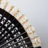 Abanico negro con encaje beige