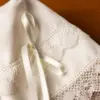 302 Gorrito blanco con lazo