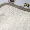 Bolso clásico de encaje de bolillos gallego.
