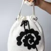 Bolso artesanal de encaje de bolillos “Fasquía”
